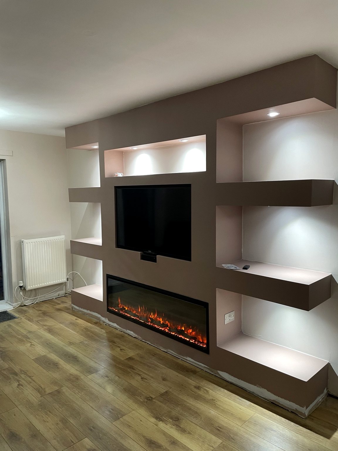 Finished media wall with fire and shelving